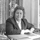 Leah Rawls Atkins circa 1985 sitting at director's desk in Pebble Hill