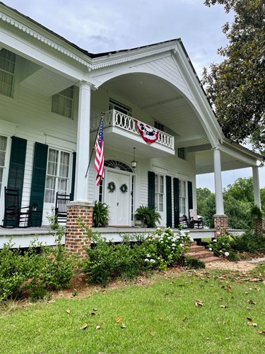The Capell House, an antebellum home adorned with patriotic decor