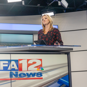 Graphic reading Partnering for Success: Auburn and Gray with photo of Auburn alumna Sally Pitts behind the WSFA news desk