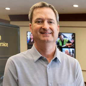 Ben Rivers at the UPS headquarters with text Creating Outside the Box