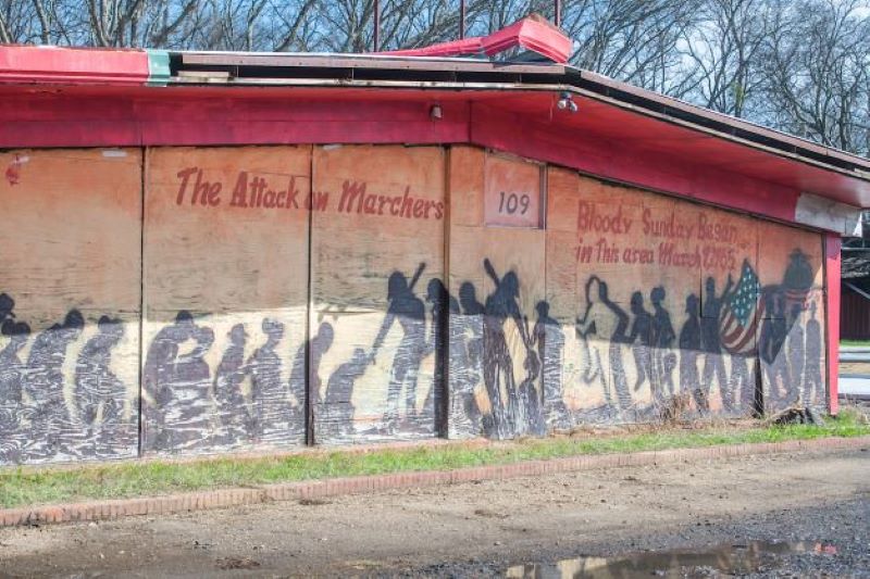 Artwork on the side of a building portrays the attack on marchers during Bloody Sunday in Selma