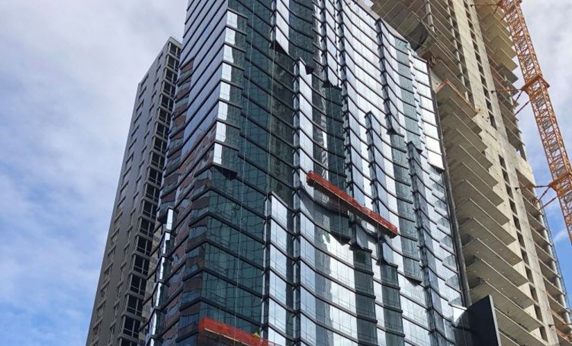 Close up of the mirrored side of a building in New York City