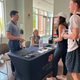 Students talk to Career Services staff at a table display