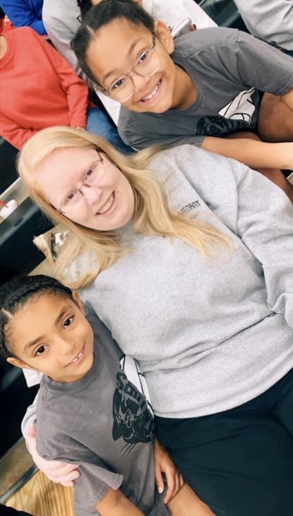 Rev. Carol Gullatt with children