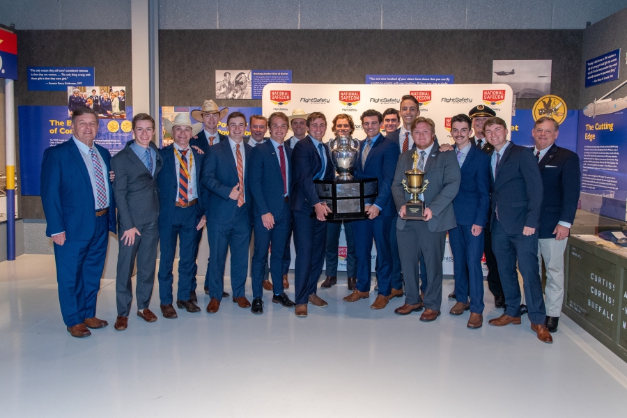 War Eagle Flying Team members stand with Loening trophy