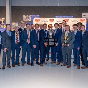 War Eagle Flying Team members stand with Loening trophy