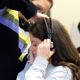 girl putting on headphones