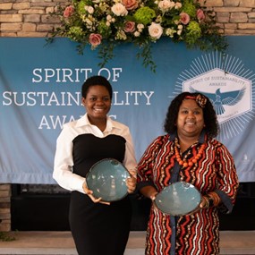 Abosede Onifade and Dr. Felicia Tuggle accepting Spirit of Sustainability Awards