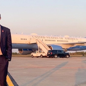Cody Sanders standing in front of Air Force One