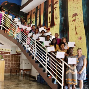 A group of Liberian students pose with certificates