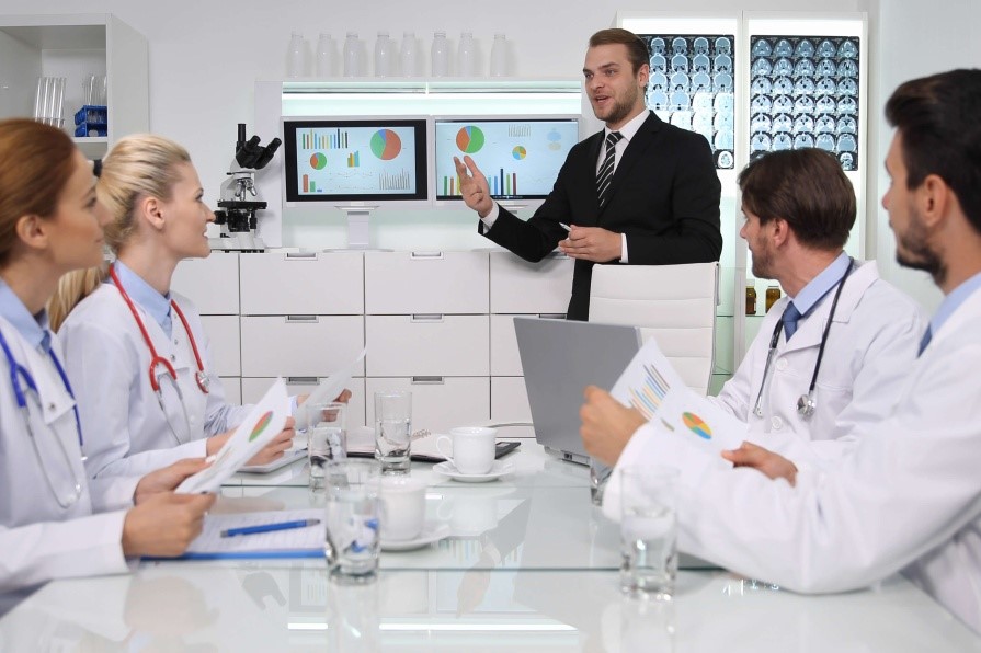 Healthcare manager talking to a group of doctors
