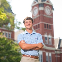 Jake Haston stands in front of Samford Hall