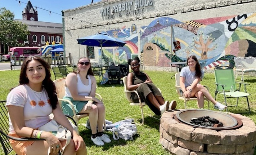 Living Democracy students gather in a community park