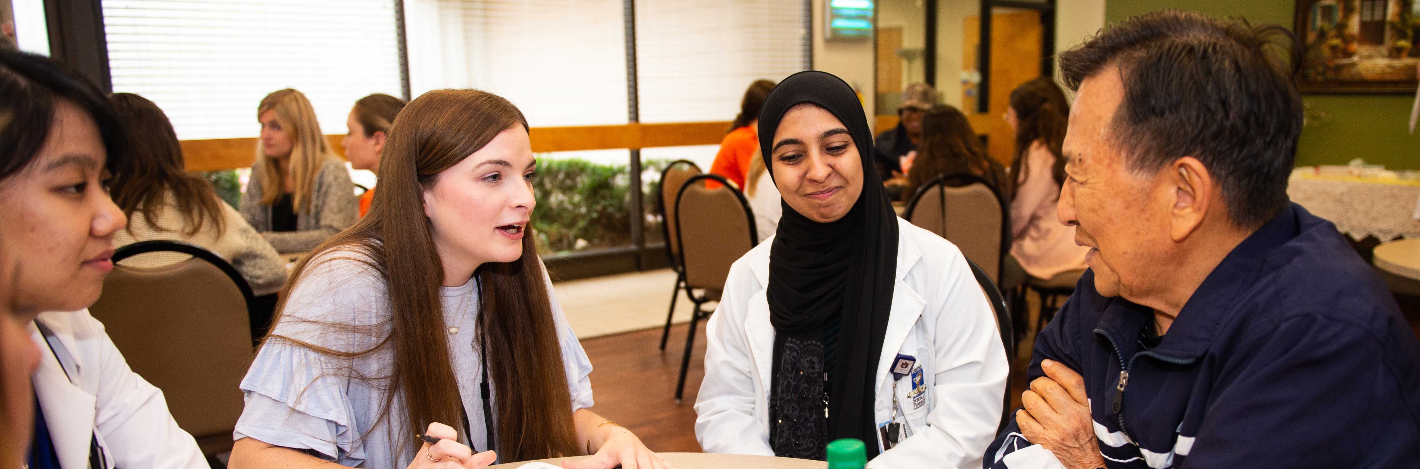 social work students talking to a client