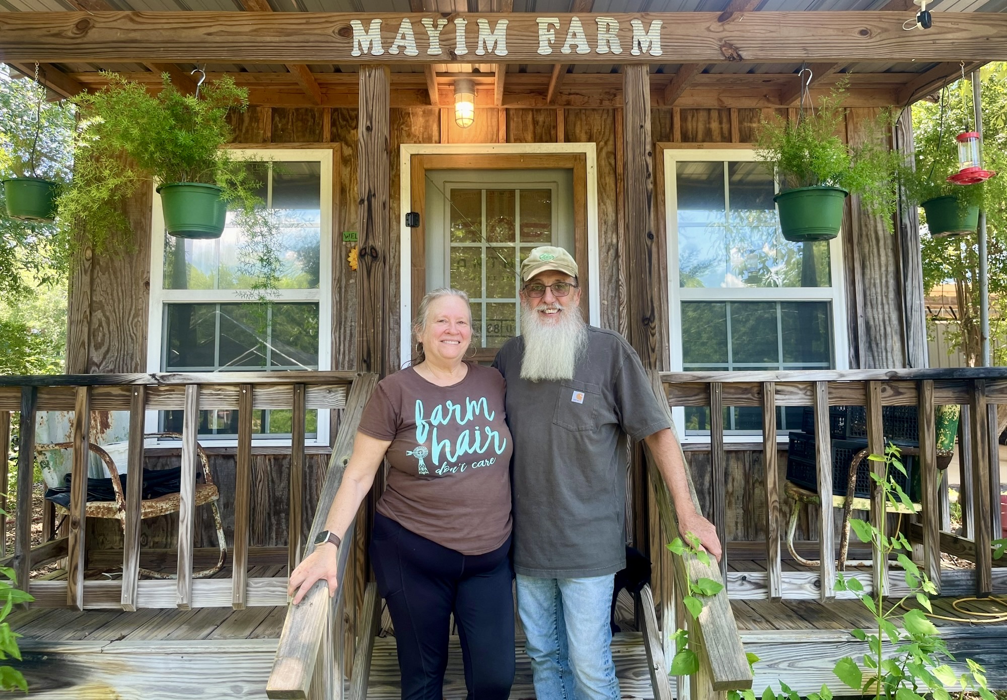 Greg and Carol Lolley take a break at Mayim Farm, established in 2011 near Elba.