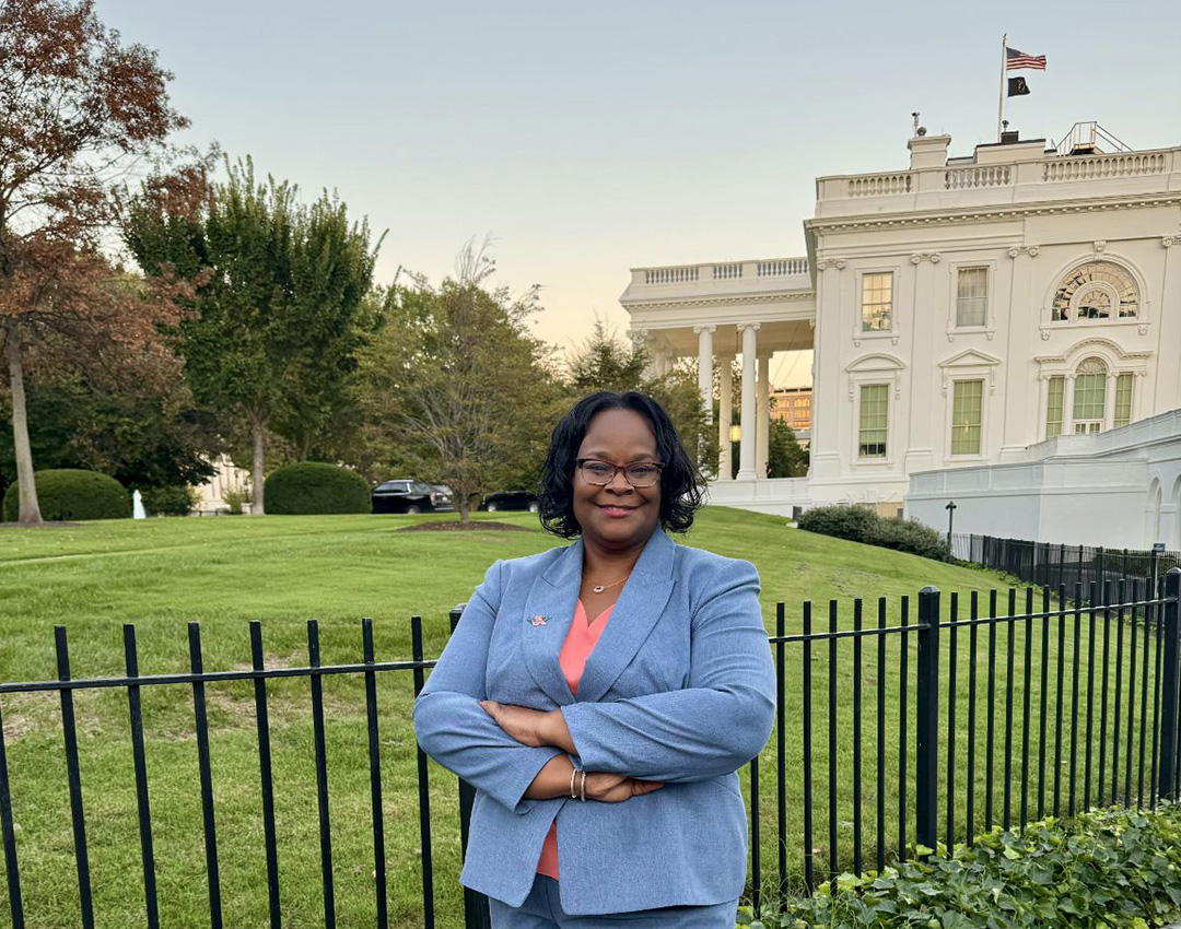 Dawn Oliver posing for photo outside the White House