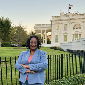 Dawn Oliver posing for photo outside the White House