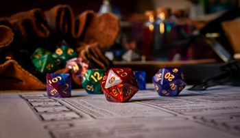 Dice rolling across a Dungeons and Dragons character sheet