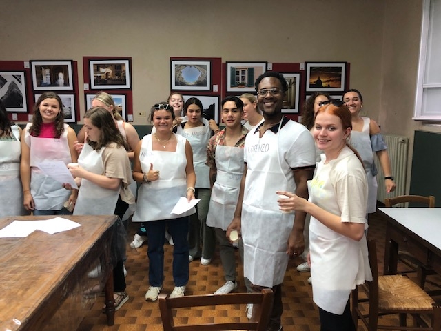 Group Of Students Wearing White Aprons
