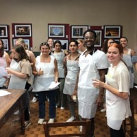 Group Of Students Wearing White Aprons