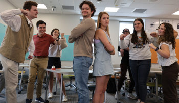Students in Craig's world history class reenacting a historical argument, with both sides angry at the other
