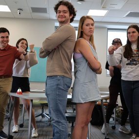 Students in Craig's world history class reenacting a historical argument, with both sides angry at the other