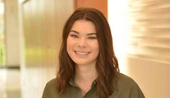 Student Ainsley McCormick sits for a formal Headshot