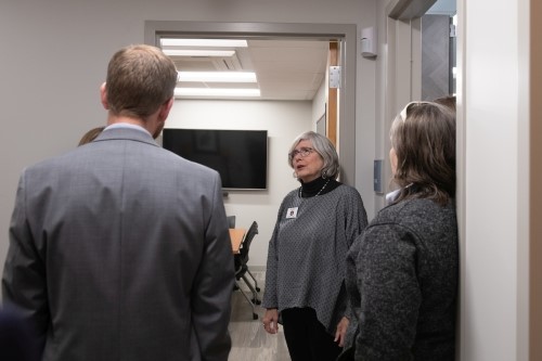 Emily Myers talking to people in the health clinic