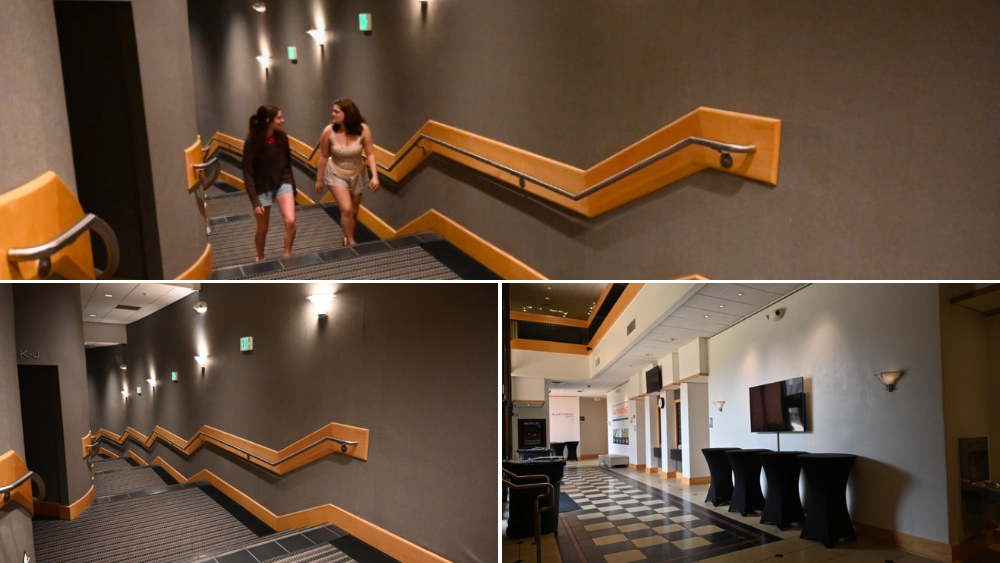 Lindsey Beam and Caroline Brooks walking to the lobby through the mainstage hallway.