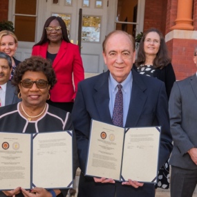 Tuskegee and Auburn representatives standing in front of Samford Hall 