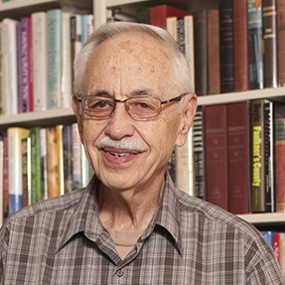 Wayne Flynt and the cover of his book Afternoons with Harper Lee