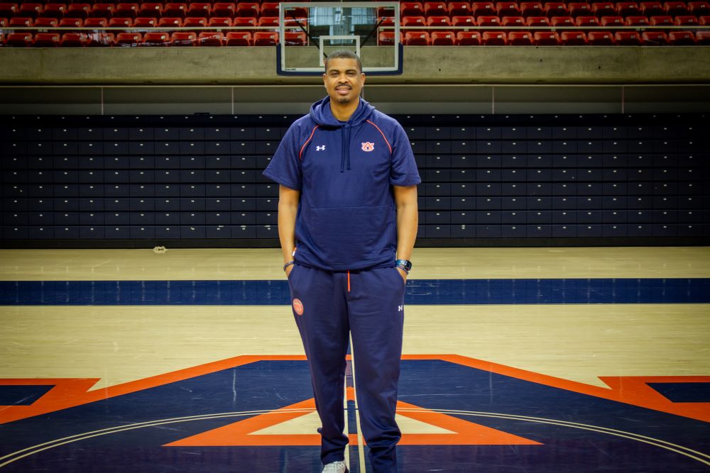 Bryant Smith standing on the court in Neville Arena