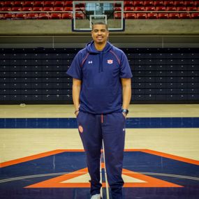 Bryant Smith standing on the court in Neville Arena