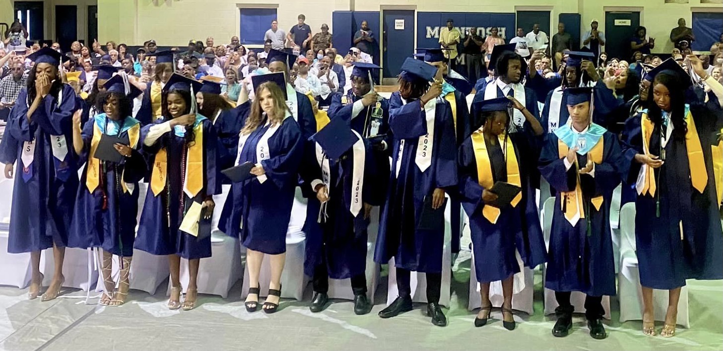 McIntosh High School's class of 2023 celebrate in graduation attire