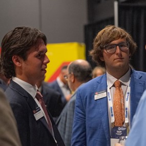 Nicholas Tarasi and Max Yeast speaking with Skift Aviation Forum attendees