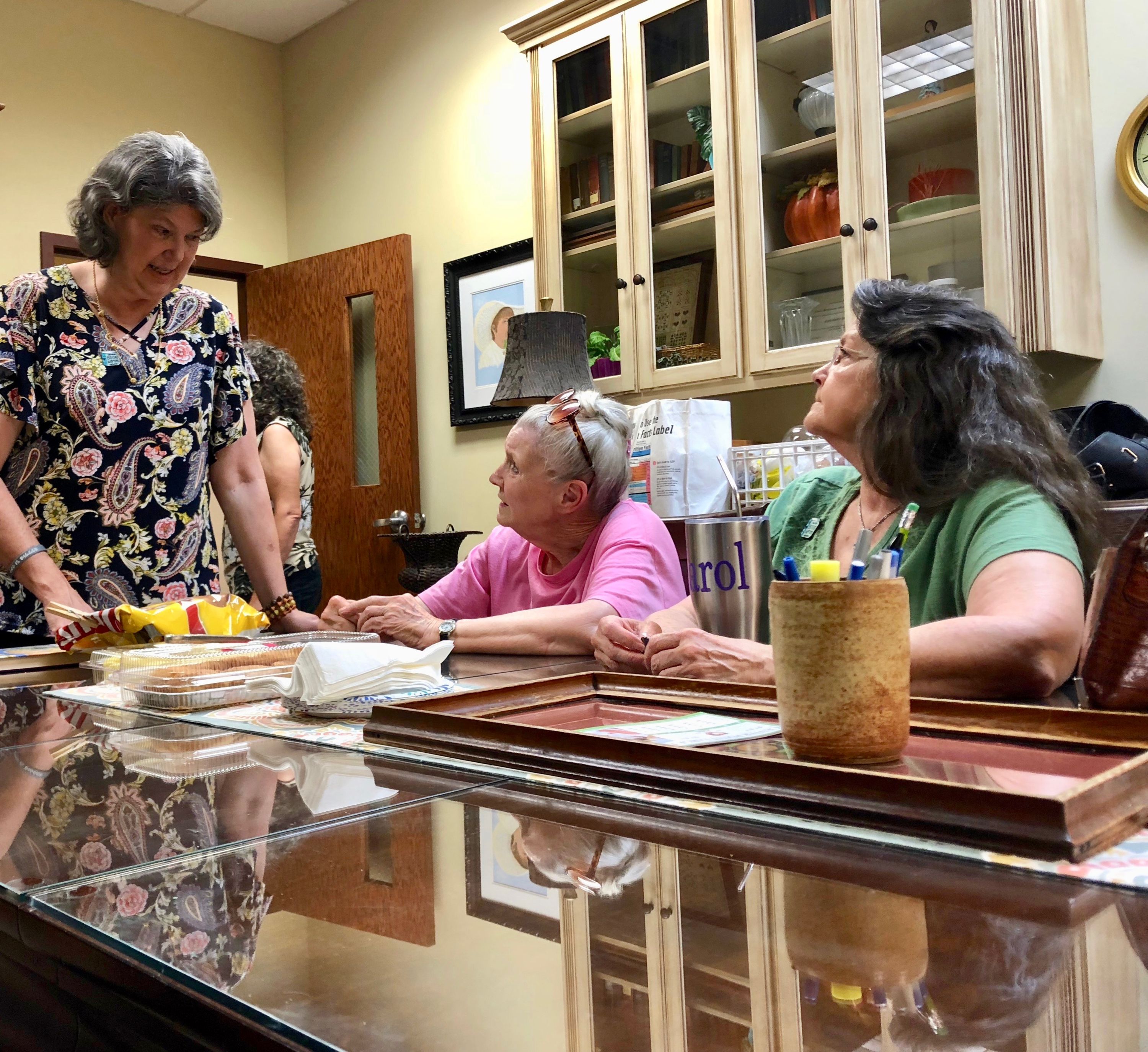 Three women having a conversation