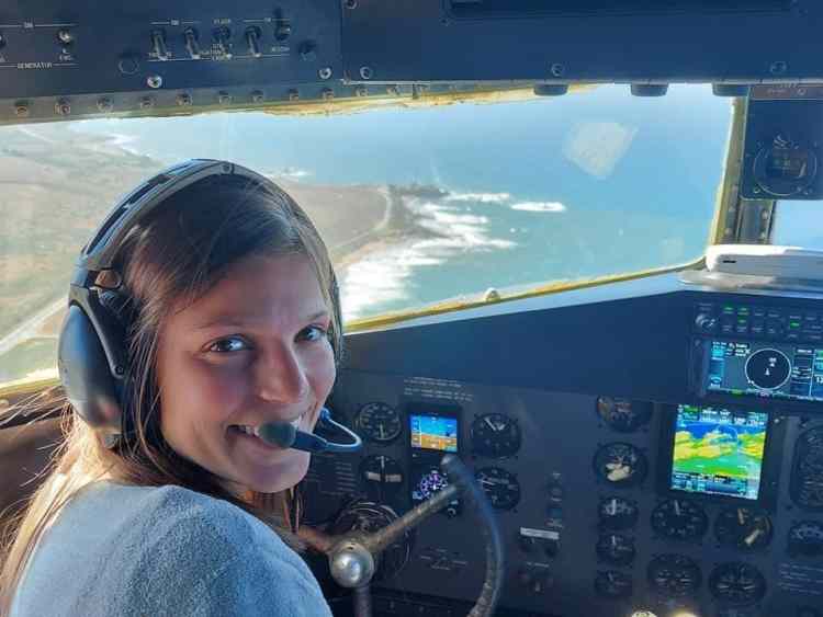 Scottie Manzo sitting in cockpit of airplane