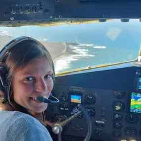 Scottie Manzo sitting in cockpit of airplane