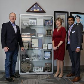 Decker's son and daughter, and a member of the aviation fraternity, reveal the dedication display
