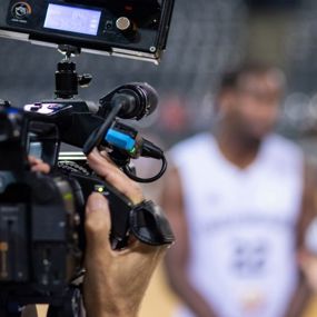 Videographers interviewing an athlete