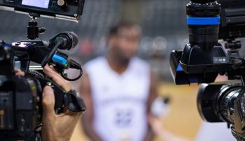 Videographers interviewing an athlete