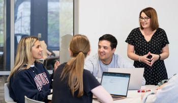Kelly Kennington leading class discussion in a history course
