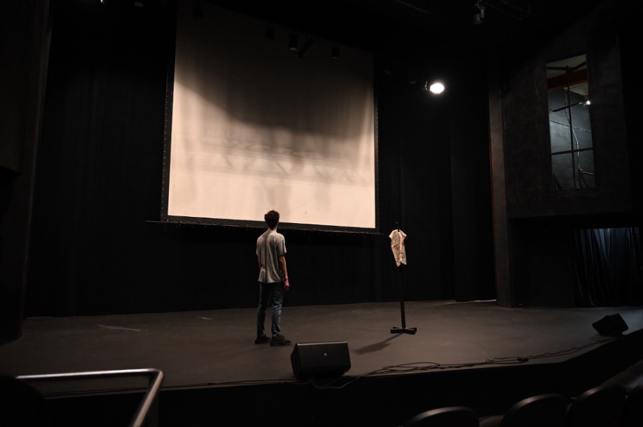 Wil Eplett standing in a newly repainted black mainstage.