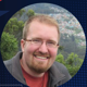 Auburn University America 250 graphic with photo of Assistant Professor of History Philip Baltuskonis