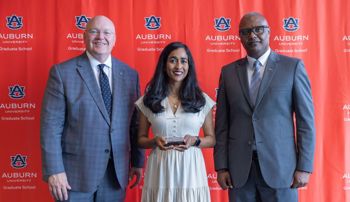 Nadia Bhuiyan accepting a 2026 Outstanding Graduate Mentor Award