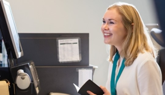 Woman working a customer service desk