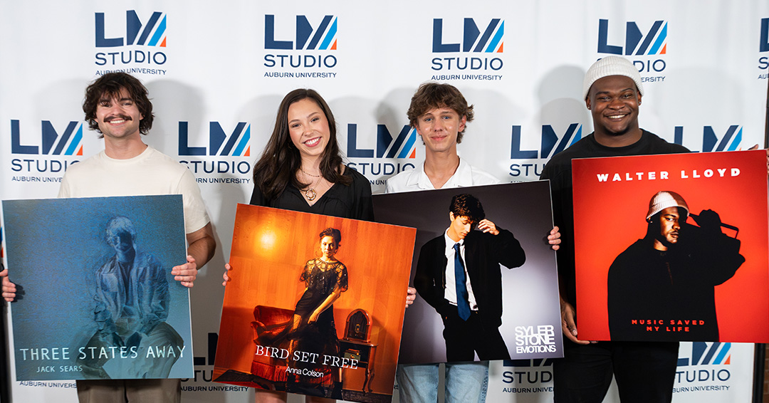 Clayton Recording Arts Honors students holding posters of their album covers
