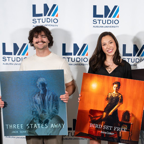 Clayton Recording Arts Honors students holding posters of their album covers
