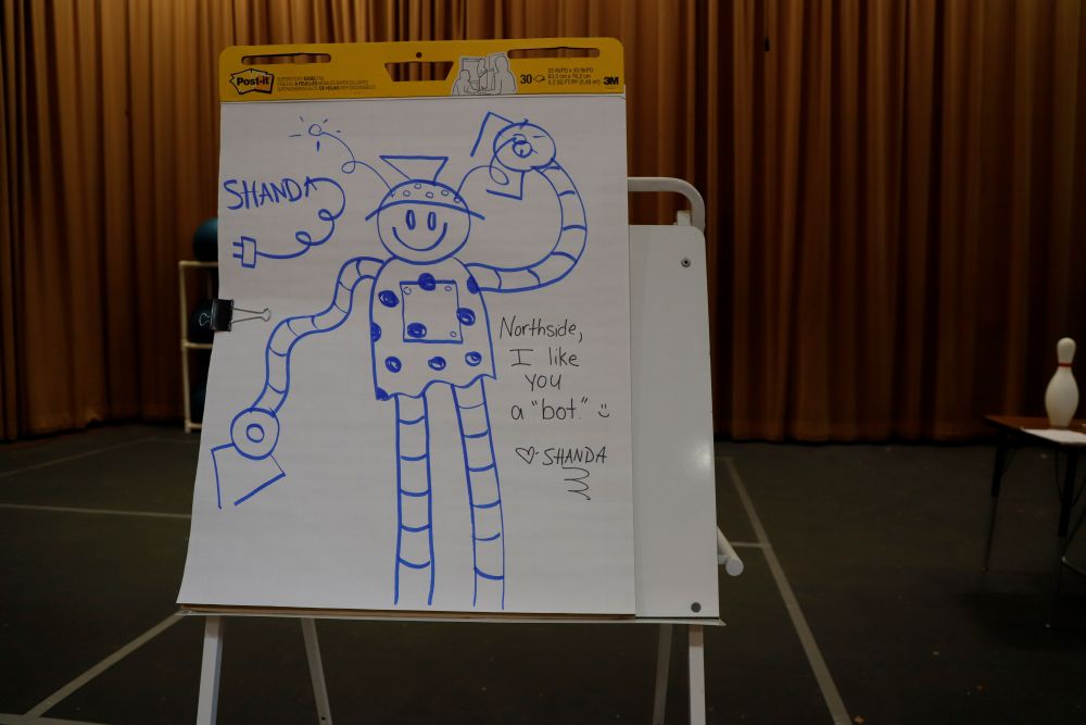 A drawing of a smiling robot by Shanda McCloskey that reads, "Northside, I like you a 'bot.'"