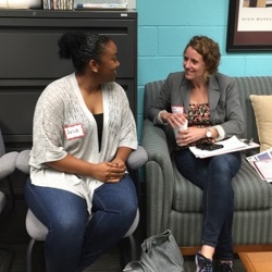 Student and Teacher talking 